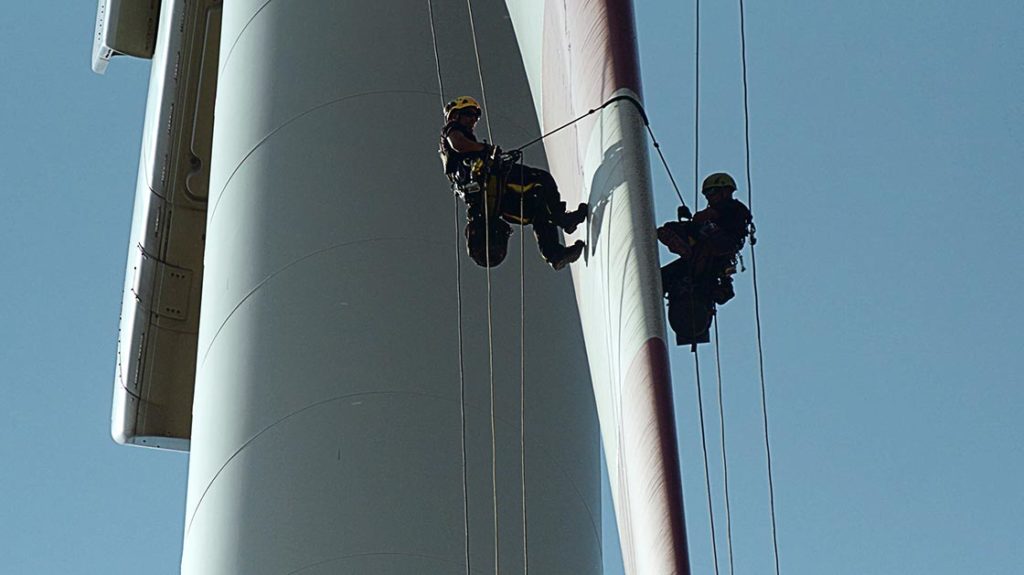 Technicians working on wind turbine